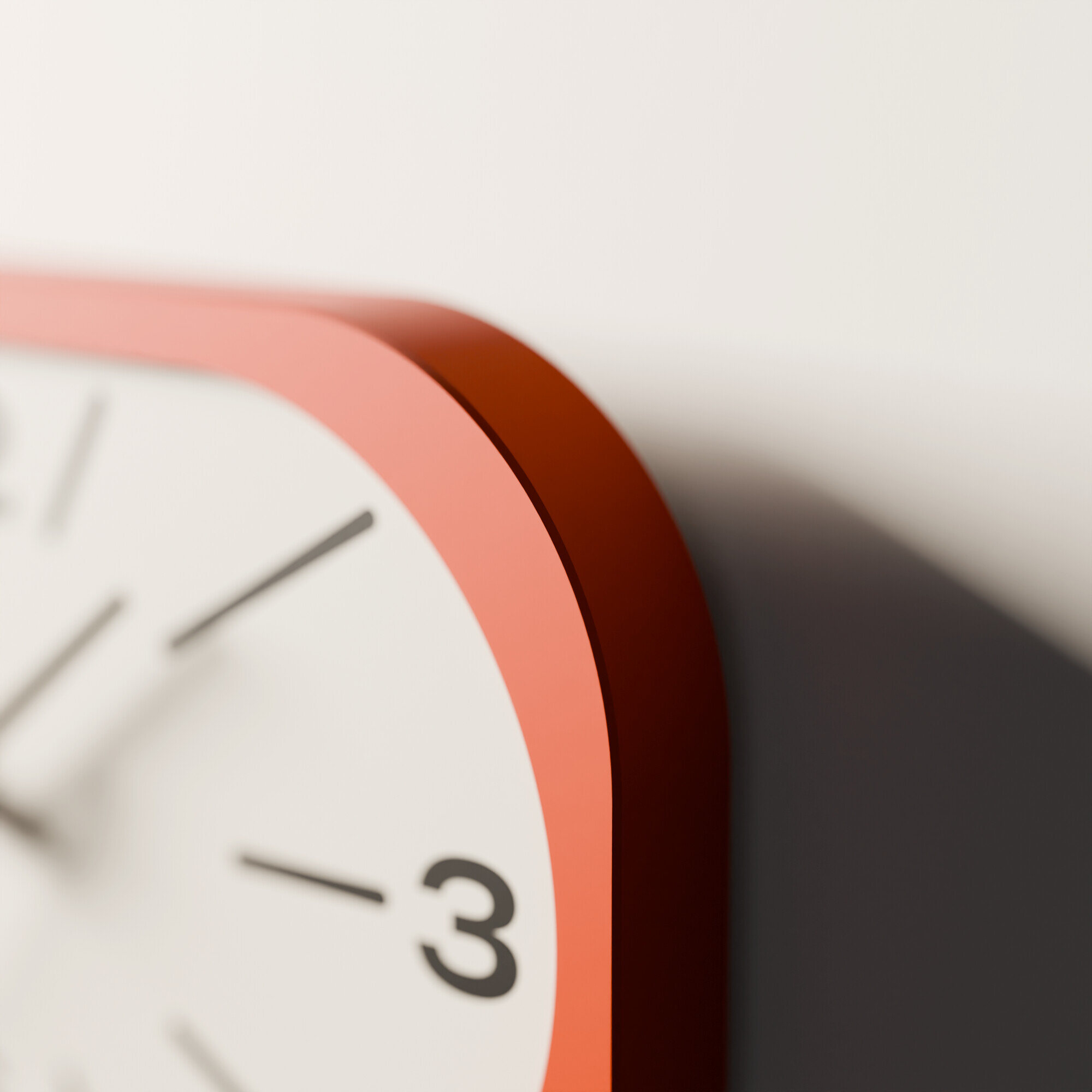 The rounded end of the orange frame up close, the dial out of focus beside it.